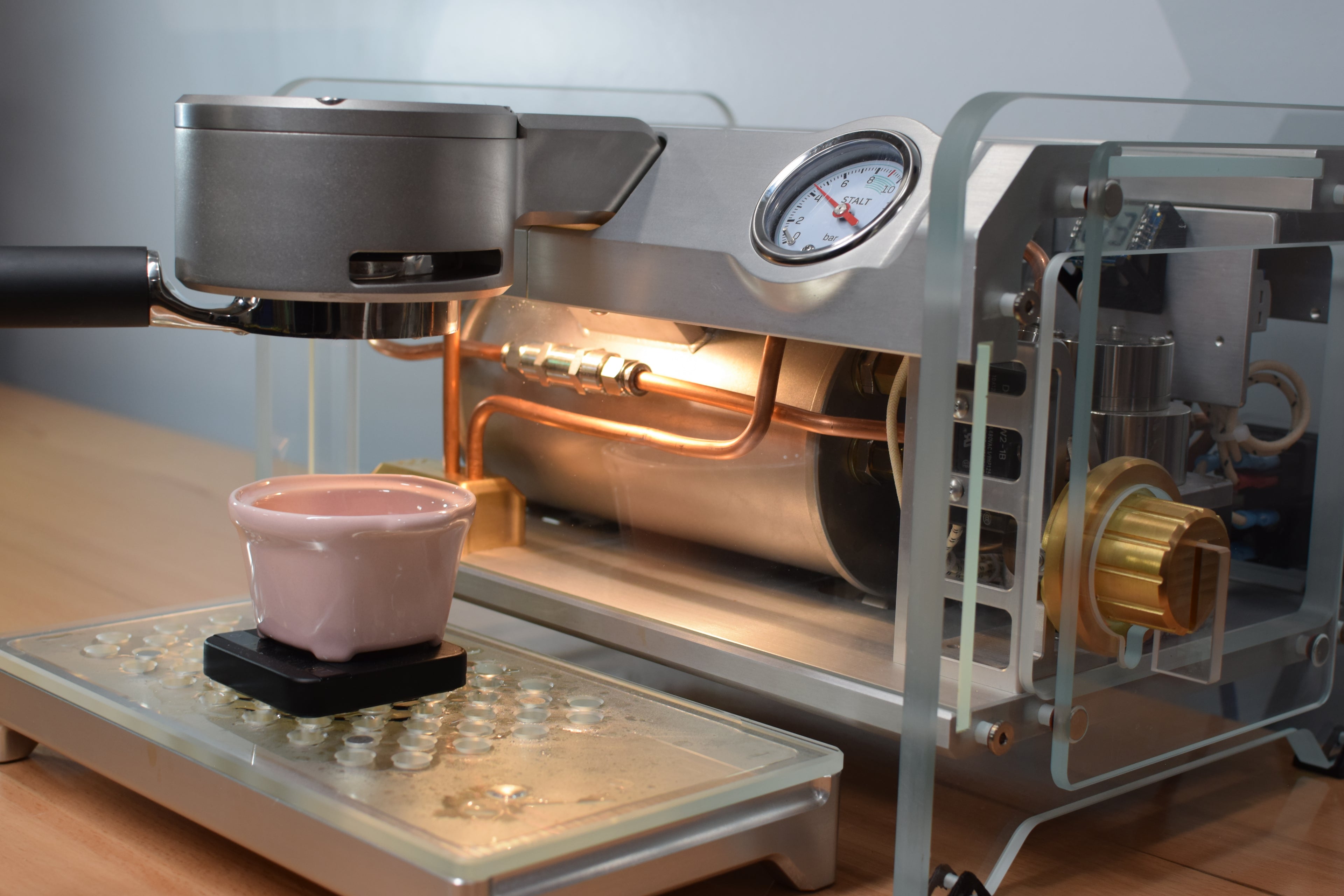 Stalt espresso machine pulling espresso shot into ceramic espresso cup